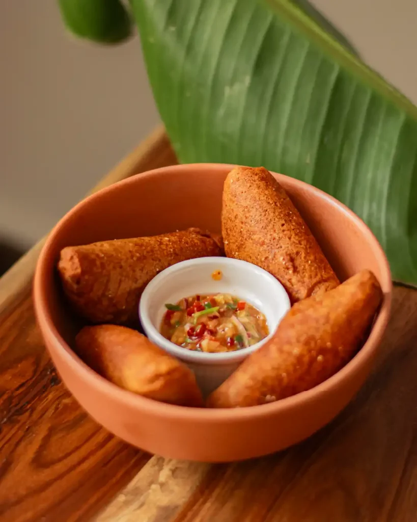 Empanada con papada duroc y ají de maracuyá